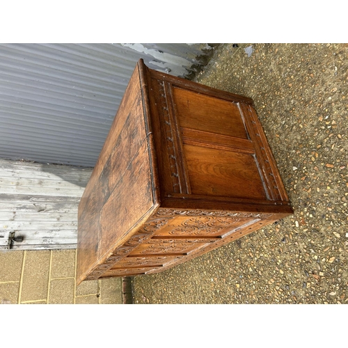 201 - A very large carved oak four panel blanket box 160x65x65