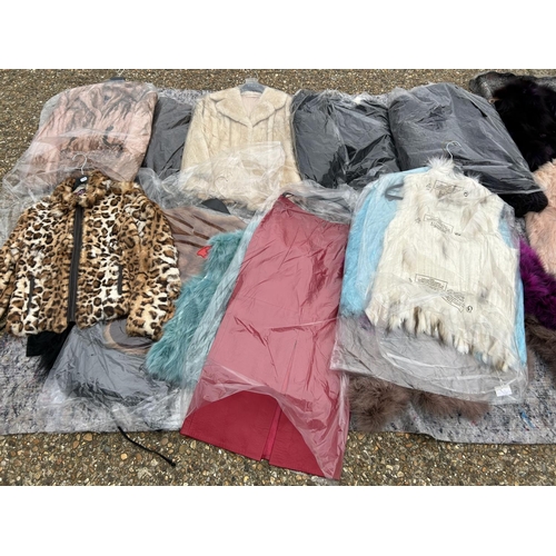 249 - A collection of 24 fur and faux fur jackets and coats