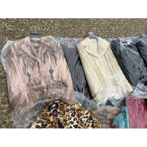 249 - A collection of 24 fur and faux fur jackets and coats