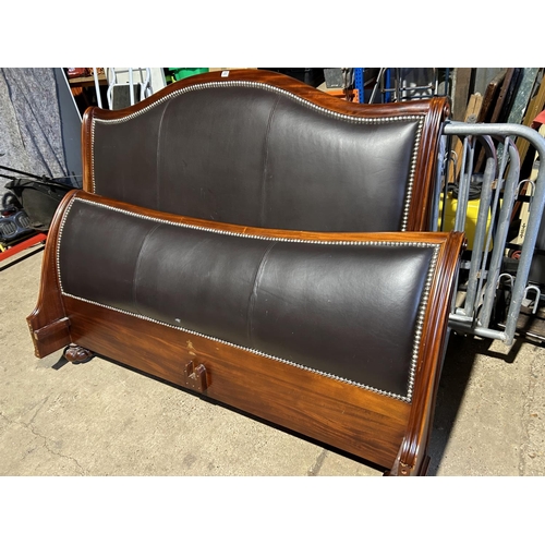 257 - A good quality mahogany and leather 6ft double bed frame by FRANK HUDSON