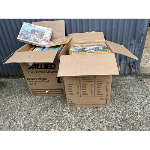 259 - 2 boxes containing a total of 39 new jigsaw puzzles