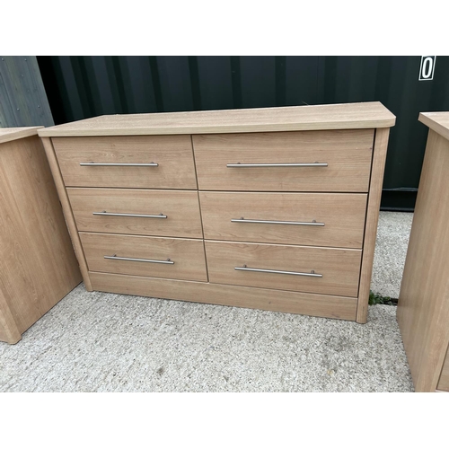 261 - A modern chest of six drawers together with a pair of matching bedsides