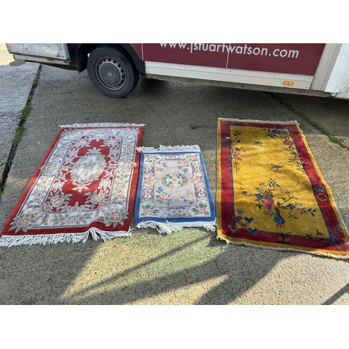 294 - Three oriental pattern rugs