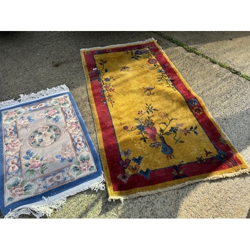 294 - Three oriental pattern rugs