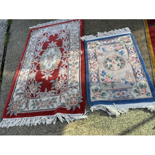 294 - Three oriental pattern rugs