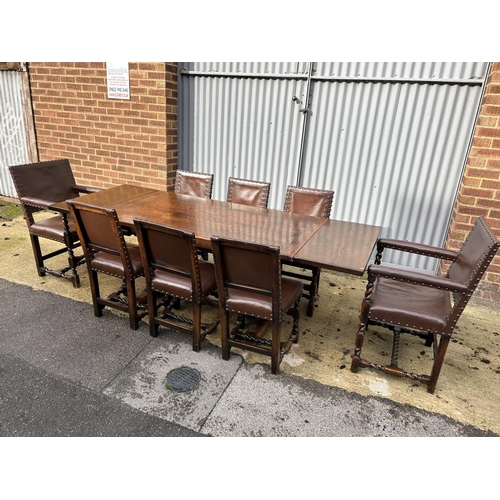 314 - Jacobean style oak drawer leaf dining table together with a set of 8 leather and brass studded oak c... 