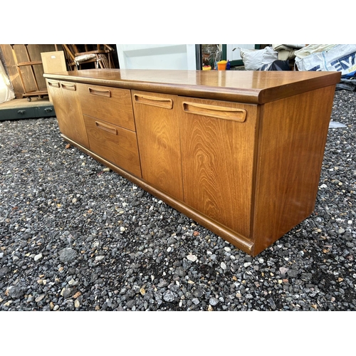 324 - A low teak sideboard / base unit