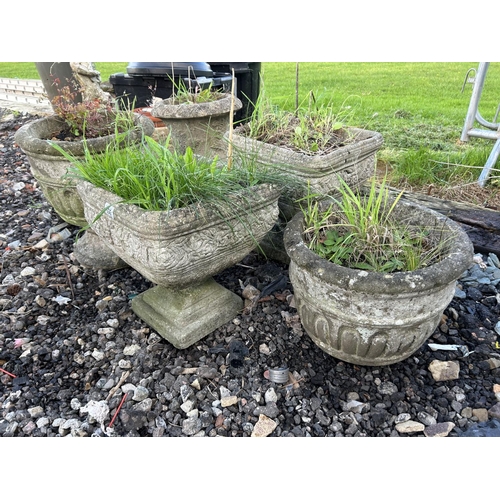 354 - Four concrete planters