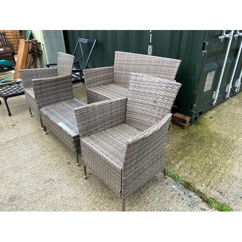 377 - Four piece rattan patio furniture set