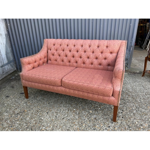 62 - A red upholstered button back love seat