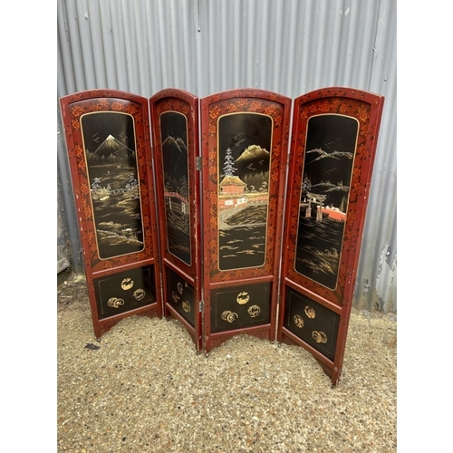 11 - A four section oriental laquered screen 137cm tall