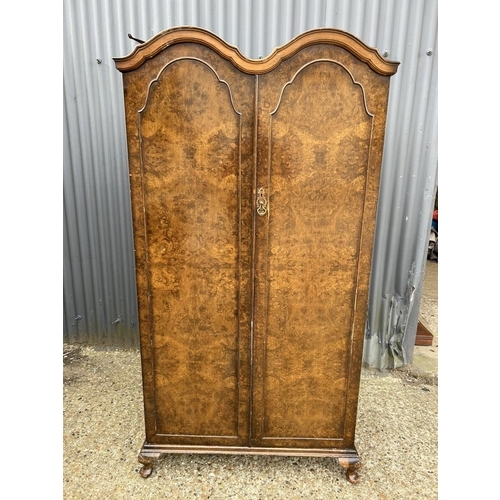 26 - A burr walnut gents wardrobe with double arch top and fitted interior 92x55x180