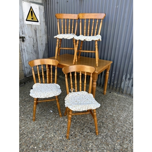 43 - A pine rectangular table together with four chairs