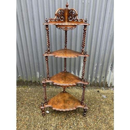 164 - A victorian walnut four tier corner whatnot