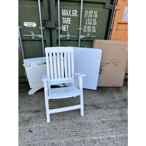 331 - A modern plastic folding table, folding chair and a plastic garden table