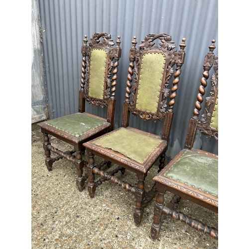 14 - A set of four French oak dining chairs with barley twist and carved backs