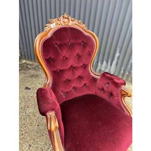 15 - A mahogany framed bedroom chair with red button upholstery