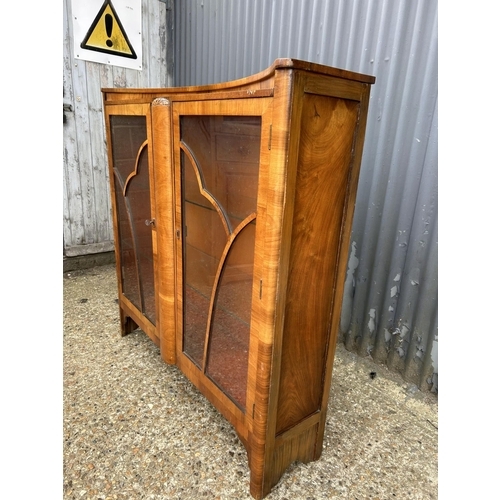 16 - An art deco walnut two door glazed display cabinet 118x30x120