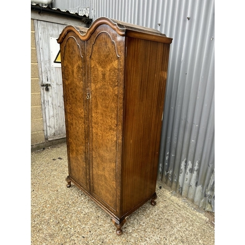 26 - A burr walnut gents wardrobe with double arch top and fitted interior 92x55x180