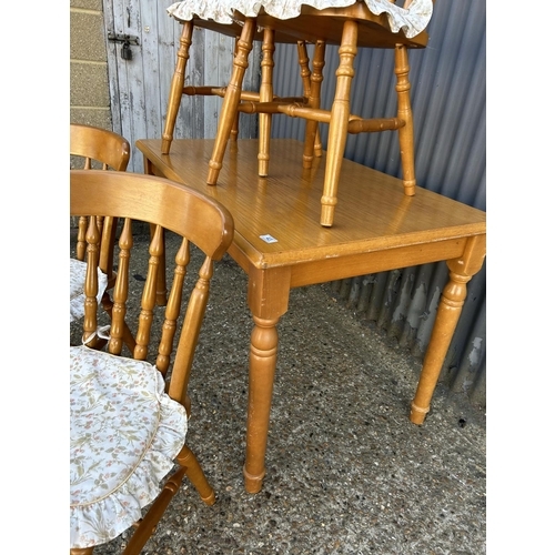 43 - A pine rectangular table together with four chairs