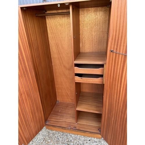 56 - A g plan fresco gents double wardrobe, fitted to the interior