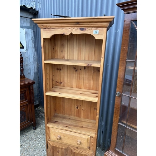 79 - A tall slim pine bookcase together with a slim mahogany bookcase