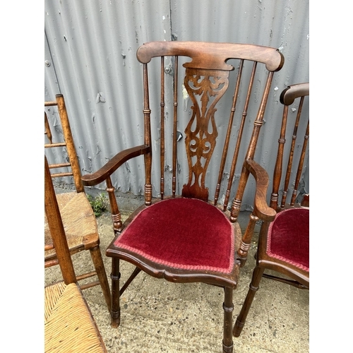 94 - Three Edwardian mahogany chairs and two rush seat chairs