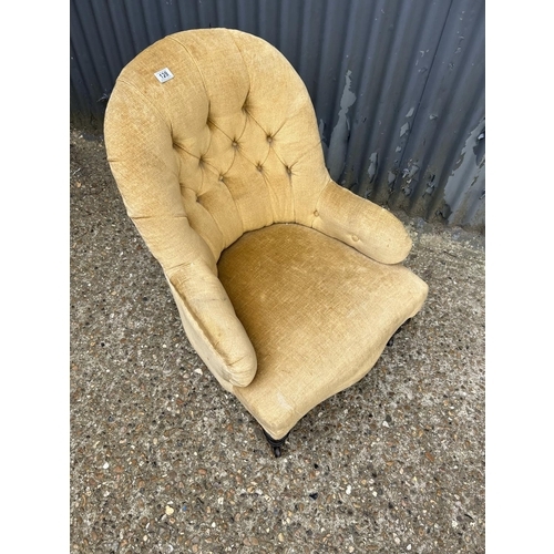 128 - A Victorian gold upholstered button back nursing chair