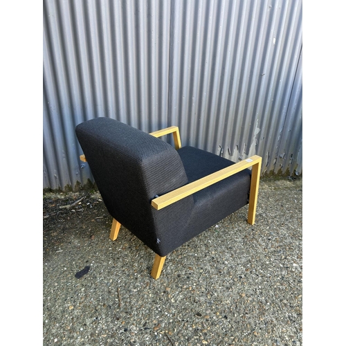 110 - Modern black upholstered designer armchair by SITS