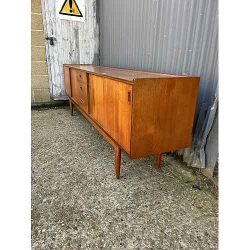 124 - Mid century Danish style Teak sideboard with 4 sliding doors and three drawers, 232 x 43 x 75cms