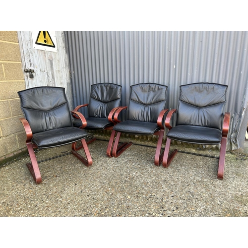 127 - Set of four modern black leather cantilever chairs