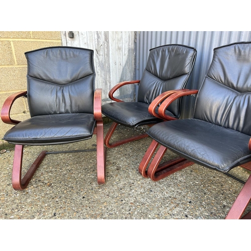 127 - Set of four modern black leather cantilever chairs