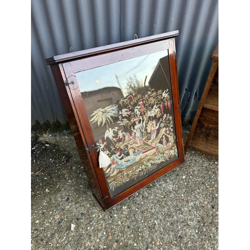 13 - A mahogany cabinet with tapestry panel together with a small oak open fronted bookcase