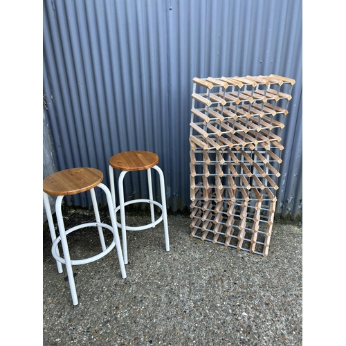 153 - Pair of lab style stools together with 3 wine racks