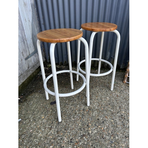 153 - Pair of lab style stools together with 3 wine racks