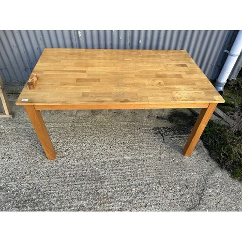 158 - A modern oak dining table 151 x 92cms