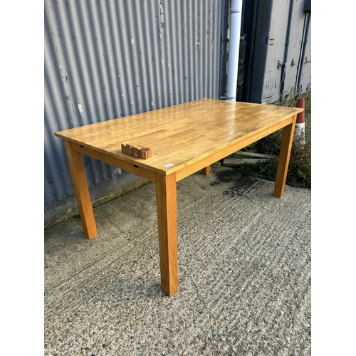 158 - A modern oak dining table 151 x 92cms