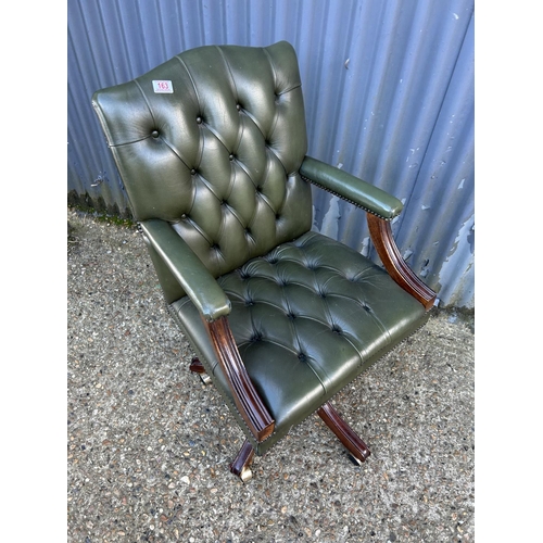 163 - A green Chesterfield buttoned leather swivel desk chair