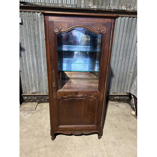 167 - A continental oak glazed single door display cabinet 78x46x16795