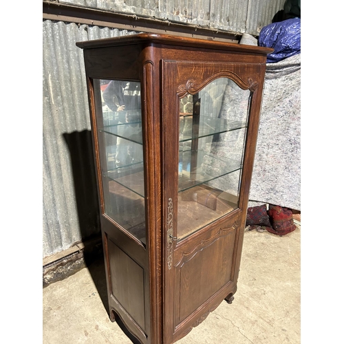 167 - A continental oak glazed single door display cabinet 78x46x16795