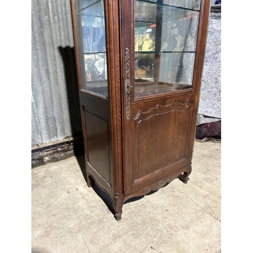 167 - A continental oak glazed single door display cabinet 78x46x16795