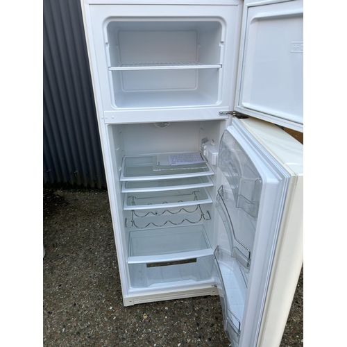 19b - A modern white SMEG fridge freezer with handbook