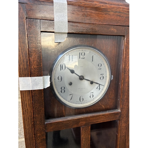 2 - A early 20th century oak cased clock by James walker London