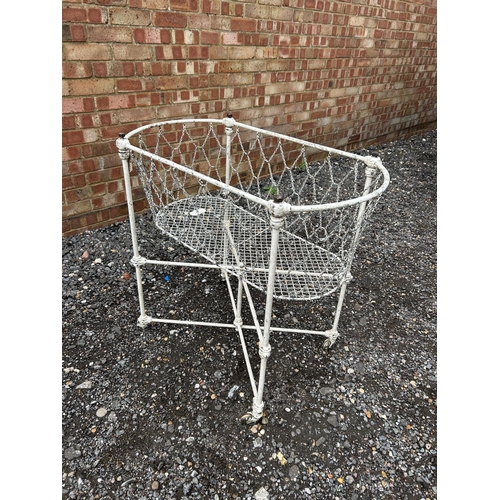 26 - A vintage white painted patent metal crib