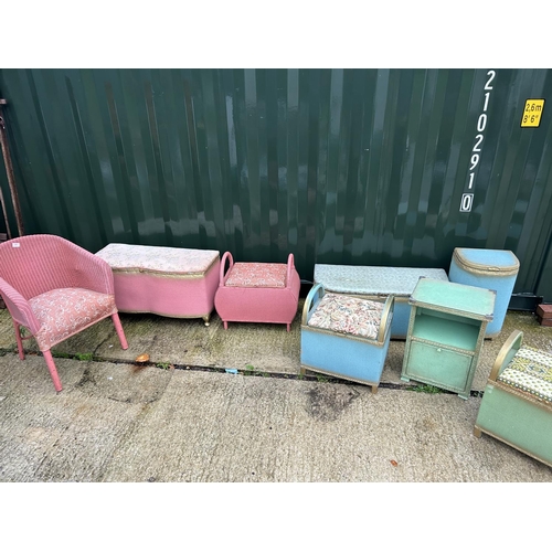 A pink lloyd loom chair tohgether with 7 other loom style linen boxes