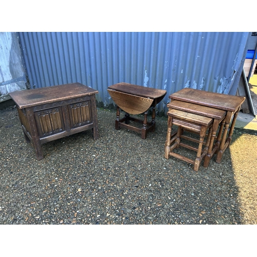 350b - A carved oak box together with a nest of three and an occasional table