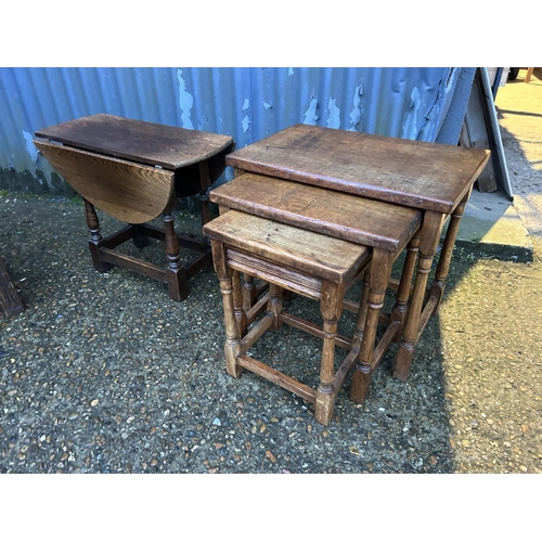 350b - A carved oak box together with a nest of three and an occasional table