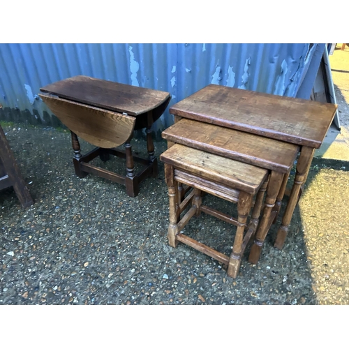 350b - A carved oak box together with a nest of three and an occasional table