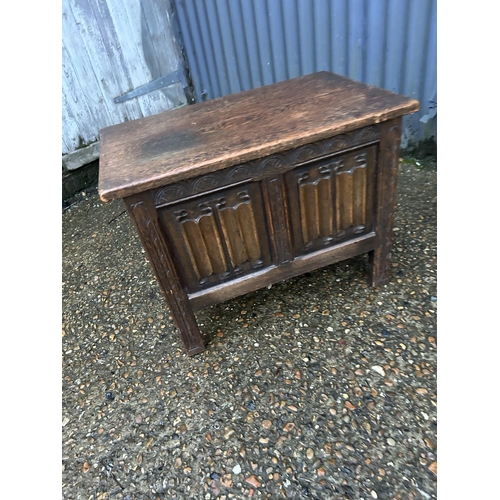 350b - A carved oak box together with a nest of three and an occasional table