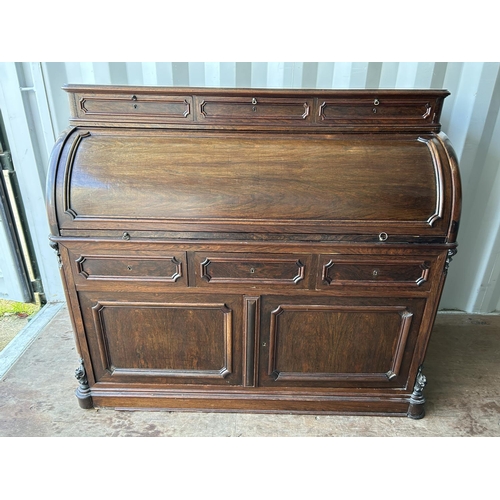 353 - A continental rosewood cylinder top bureau desk 130x60x90